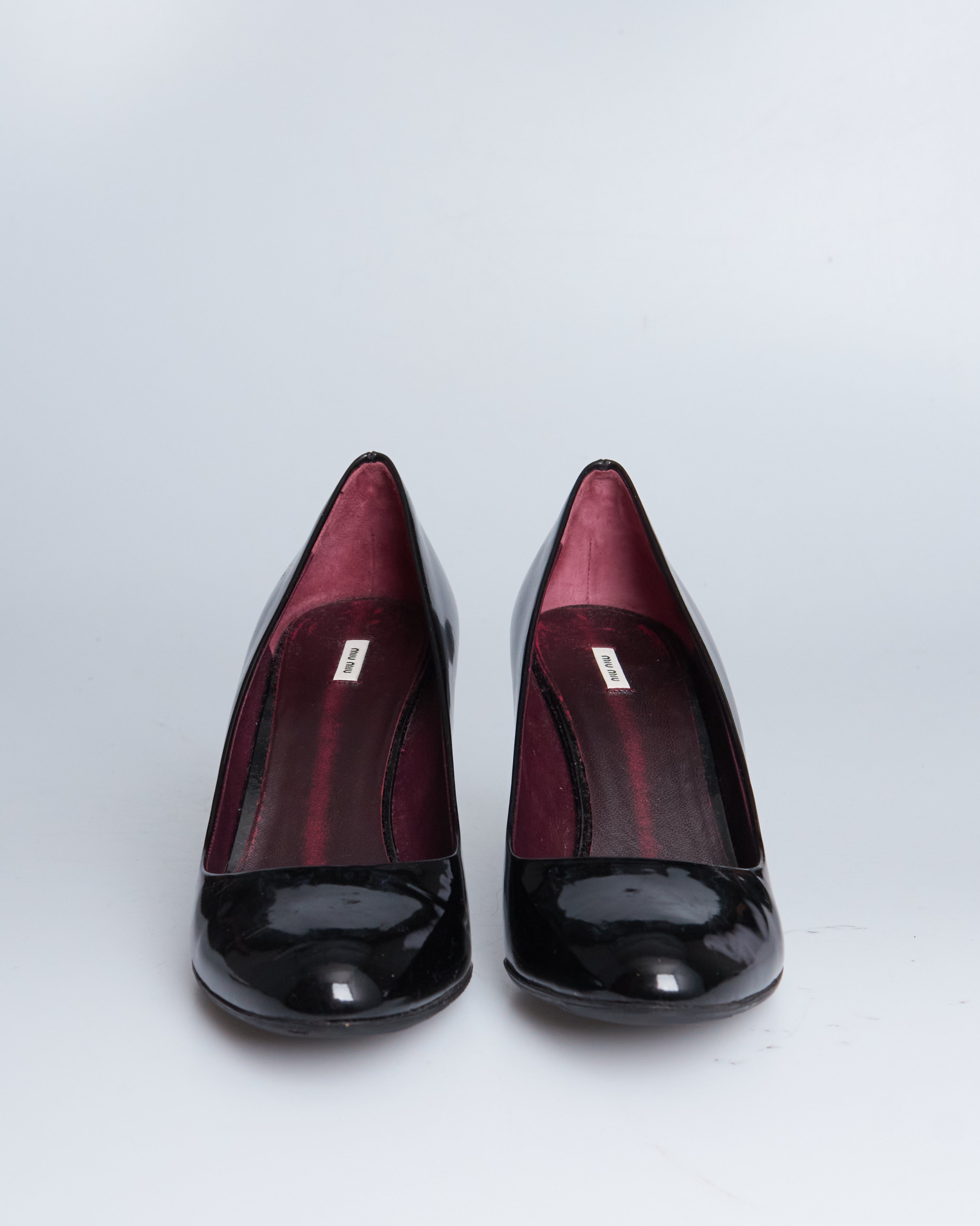 Miu Miu patent leather wedge pumps
