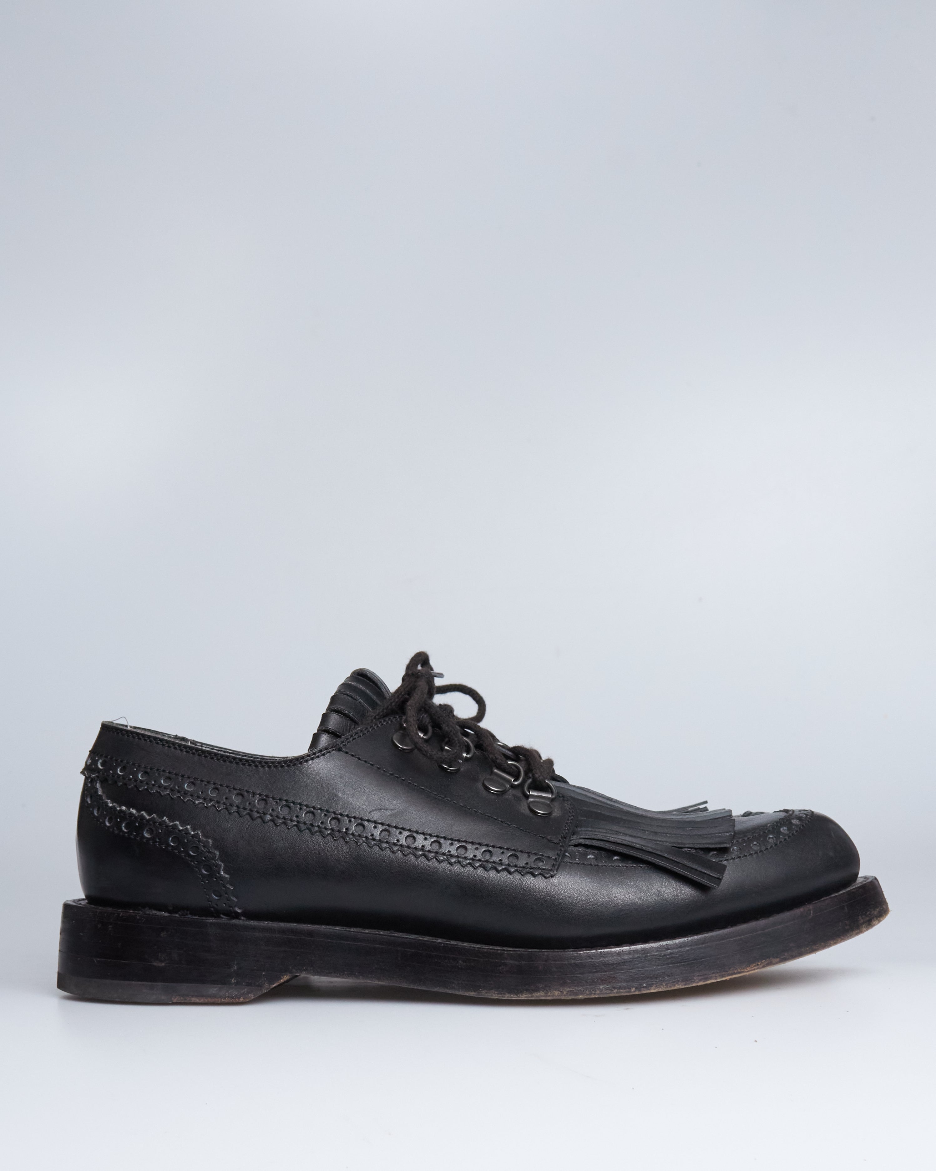 Gucci fringe leather lace ups