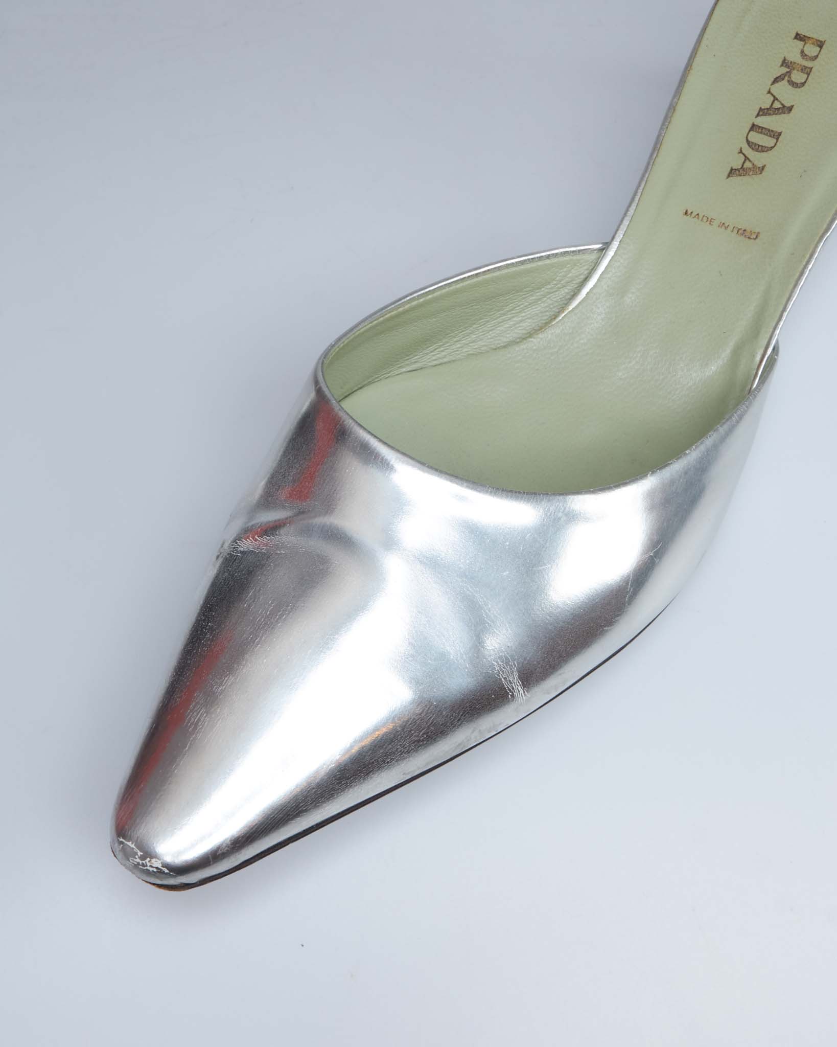 Prada silver metallic pointed-toe mules